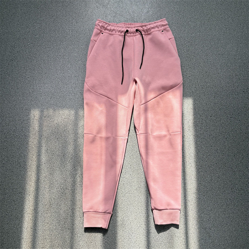 Pantalones casuales deportivos primavera y otoño aire laminado de algodón con cremallera pantalones deportivos para hombres y mujeres