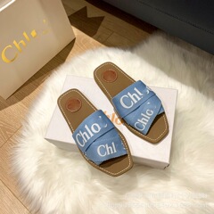 外国貿易のネットの赤い金の高いバージョンのCD女性のカジュアルな1字は外を引きずってキャンバスの平底のスリッパのカップルのフランスの潮の札を着ます。