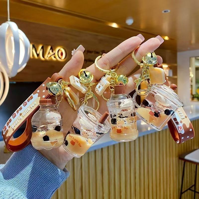 Oil-filled bubble tea keychain floating small milk bear liquid quicksand bottle pendant couple gift bag hanging ornaments for women