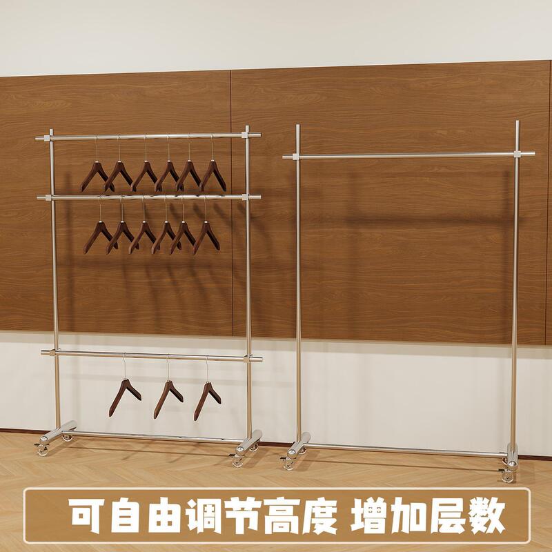 Adjustable stainless steel double-layer floor-standing clothing rack for clothing stores, mobile display shelf with wheels for women's clothing stores