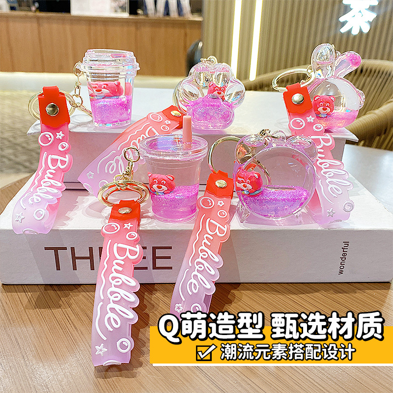 Botella de arena flotante de aceite flash fresas oso muñeca colgante llavero mochila para hombres y mujeres colgantes de automóviles pequeños regalos al por mayor