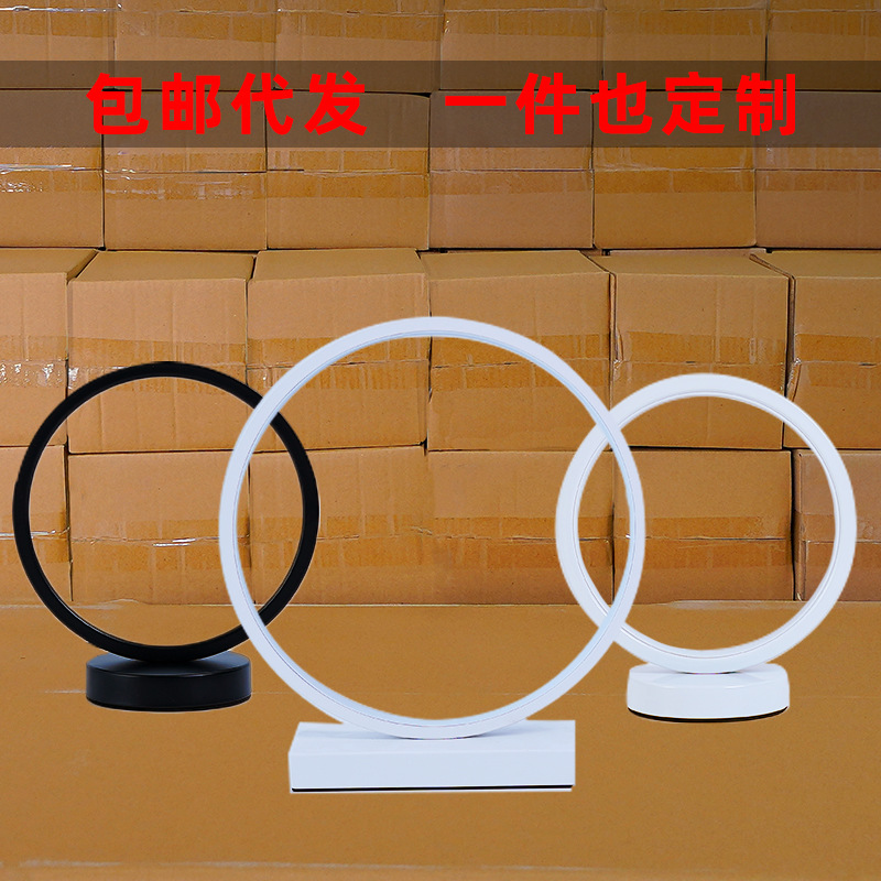 Lámpara de mesa LED nórdica creativa, luz ambiental circular para dormitorio, cabecera o decoración.