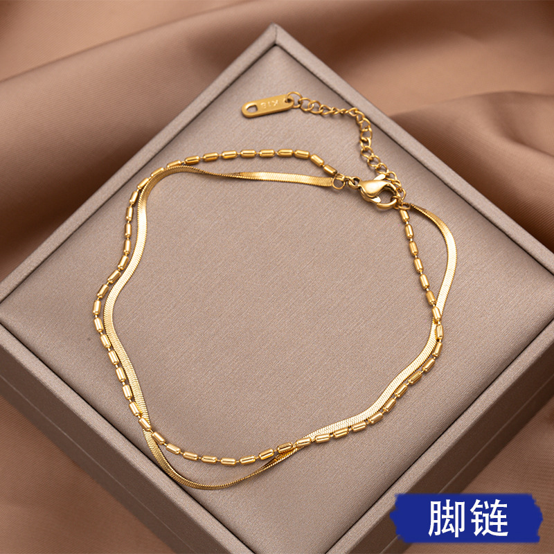 Viento frío de doble capa de hueso de serpiente tobillera de acero de titanio de las mujeres en línea popular anillo de la pierna joyería no se desvanece Accesorios de playa de las mujeres