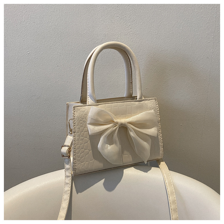 Elegant Solid Color Bowknot Square Zipper Handbag display picture 4