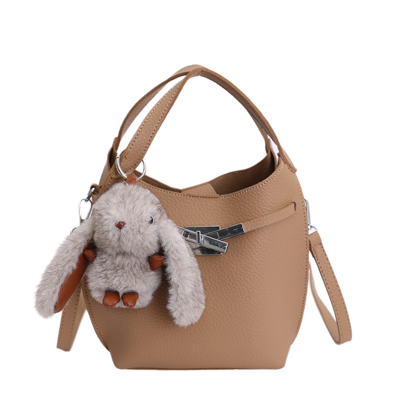 Bolso de mujer nuevo estilo coreano nicho de moda lichi bolso de cubo portátil de alta sensación de ocio mochila de viaje