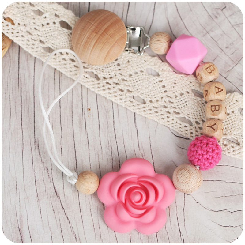 Nuevos suministros para bebés Beech chupete clip calmante bebé DIY Nombre de dibujos animados Rosa chupete cadena anti-gota cadena