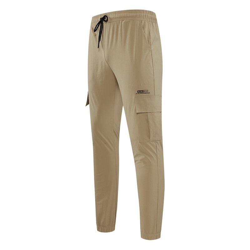 Pantalones de chándal primavera hombres al aire libre Secadores rápidos tejido suelto estiramiento pie fitness Baloncesto Pantalones casual