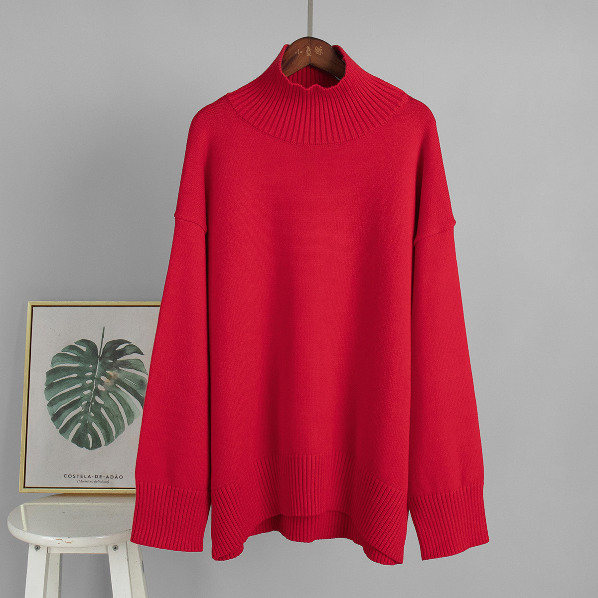 Suéter de cuello alto transfronterizo para mujeres 2025, Europa y los Estados Unidos de otoño y invierno explosivo color sólido jersey de punto de cuello alto suéter suelto para mujeres