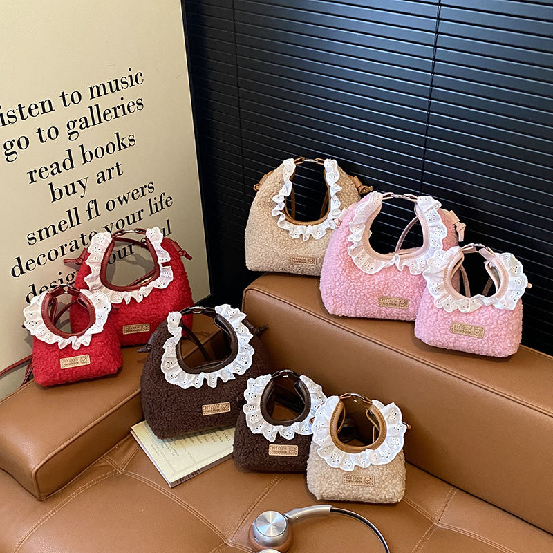 Bolsos para niños nuevos bolsos de encaje de color sólido extranjero nicho de diseño para padres e hijos cambio bolsos de mochila