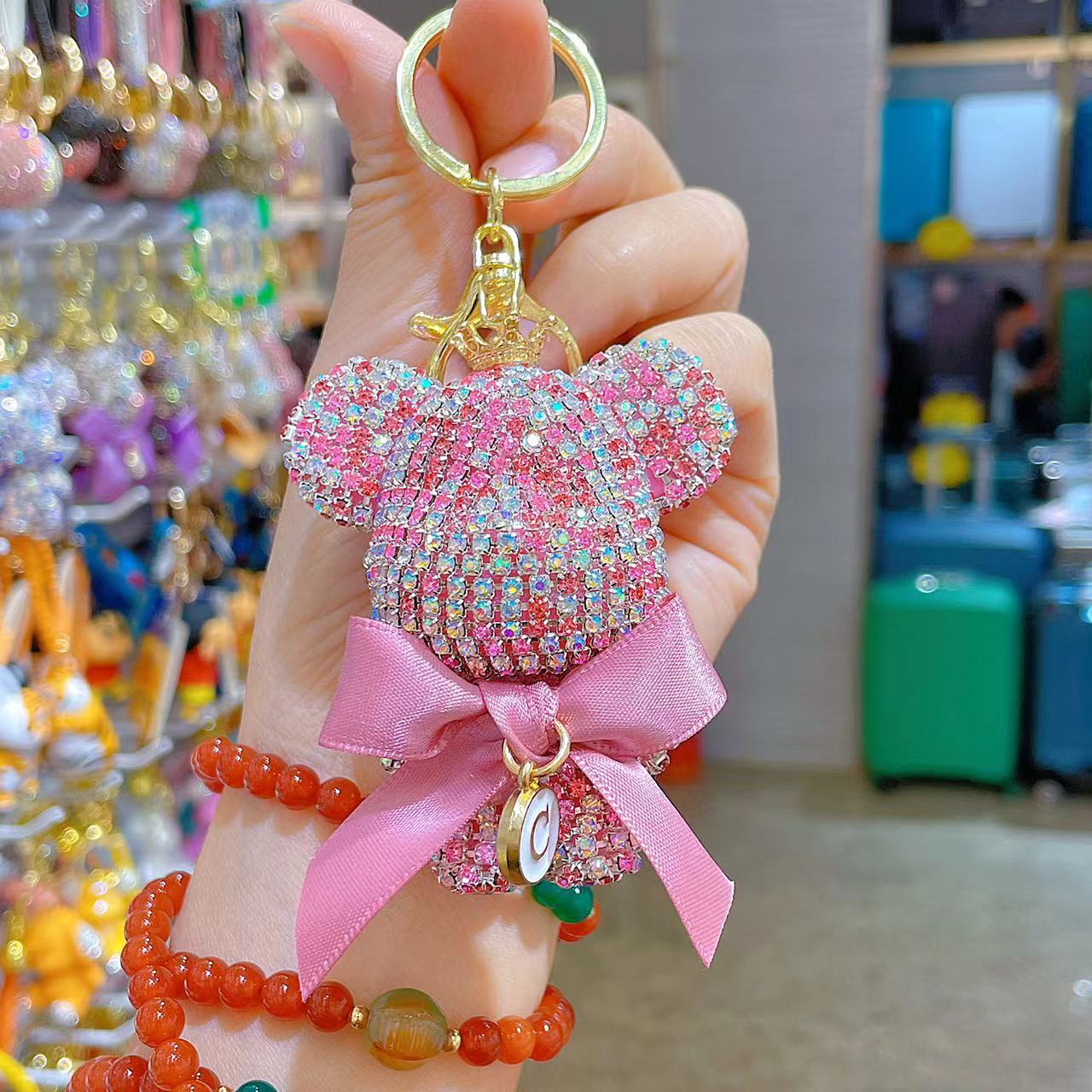 Venta directa de fábrica de lujo completo diamante muñeca llavero pajarita cabeza grande oso completo diamante bolsa colgante coche llavero