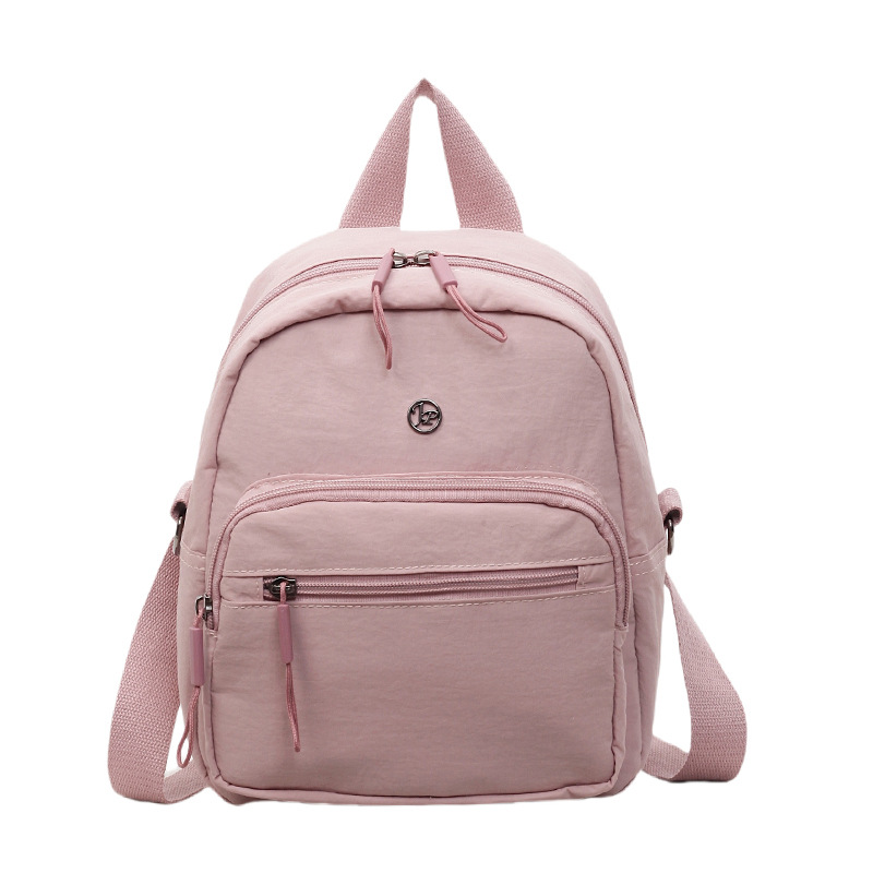 Mini mochila ligera coreana de moda casual mochila de viaje al aire libre de viaje de viaje simple mochila de estudiantes