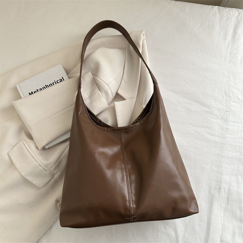 Bolsa de mujer de gran capacidad, textura de 2024, nueva moda simple, bolsa de hombro universal, bolsa de brazo de viaje de color.