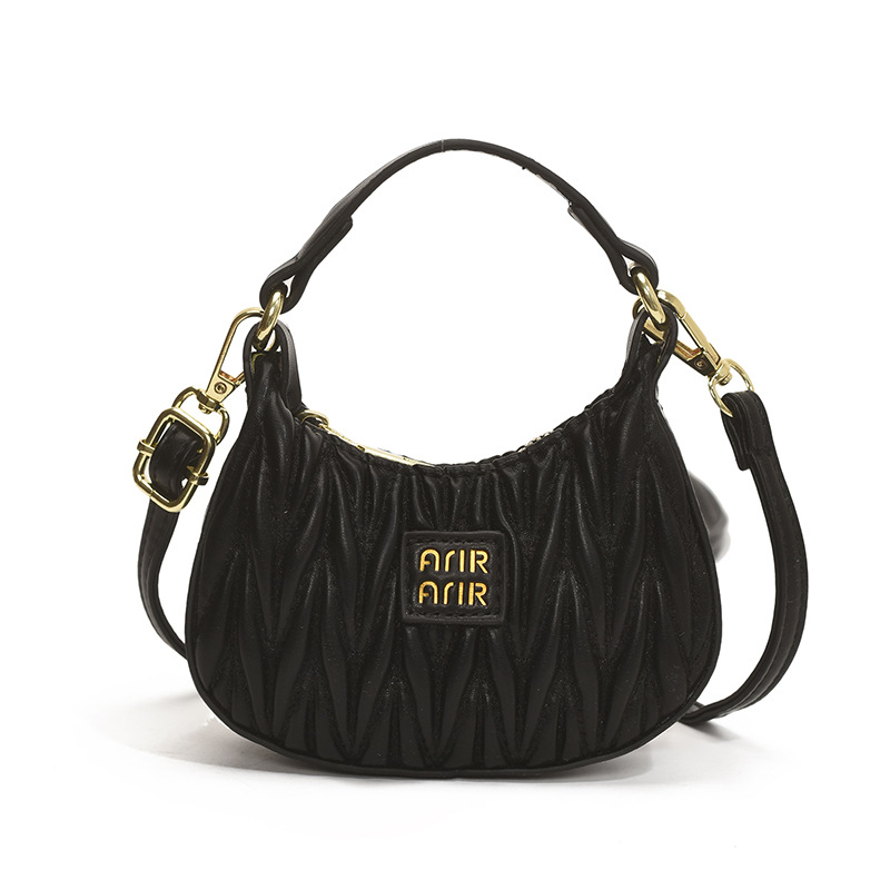 Versión coreana del bolso de hombro de niña de color sólido simple estilo occidental mini bolso de la axila portátil del bebé nuevo bolso de los niños plisado