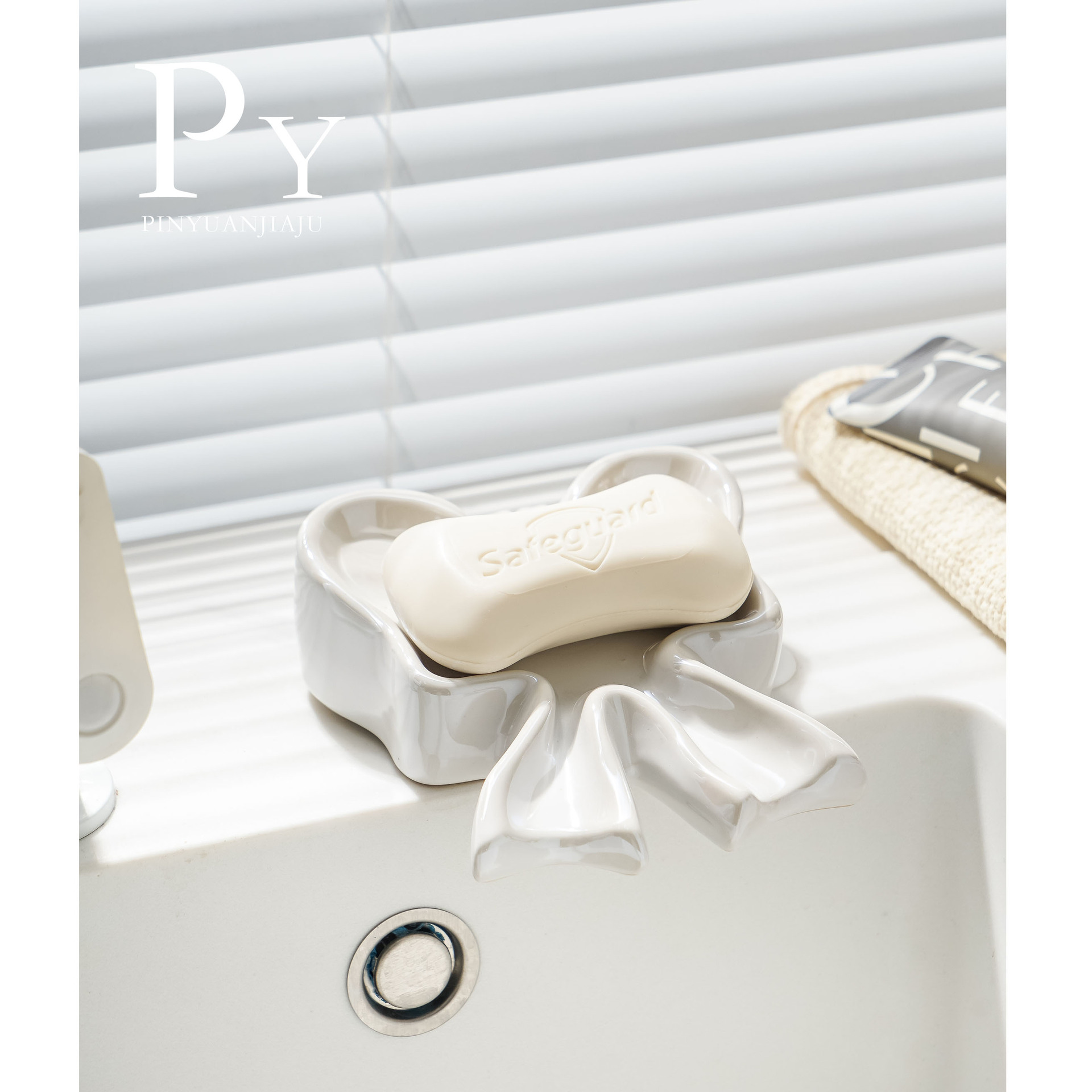 Jabonera de cerámica en forma de arco con drenaje para lavabo de baño, creativa, de alta gama, ligera y lujosa, soporte para jabón transfronterizo.