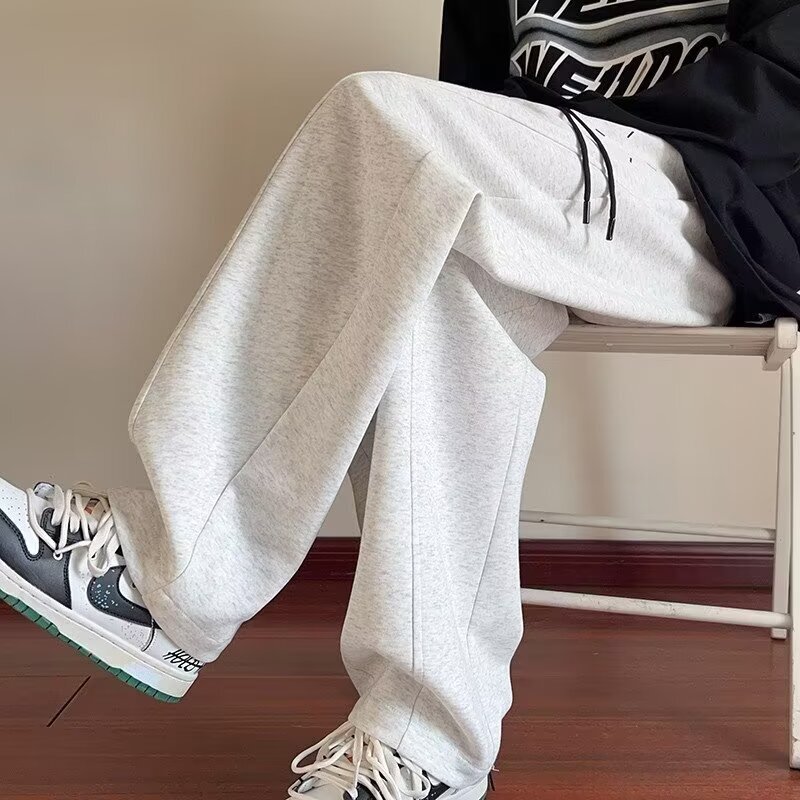 デザイン感のある重ポンドの曲がり角のズボンの男性の秋冬のベルベットは厚くてゆったりしています。|undefined