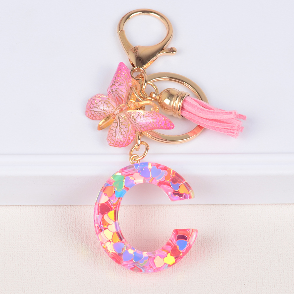 Explosiones transfronterizas amor sequillas iniciales llavero al por mayor resina letra mariposa fringe llavero se puede personalizar