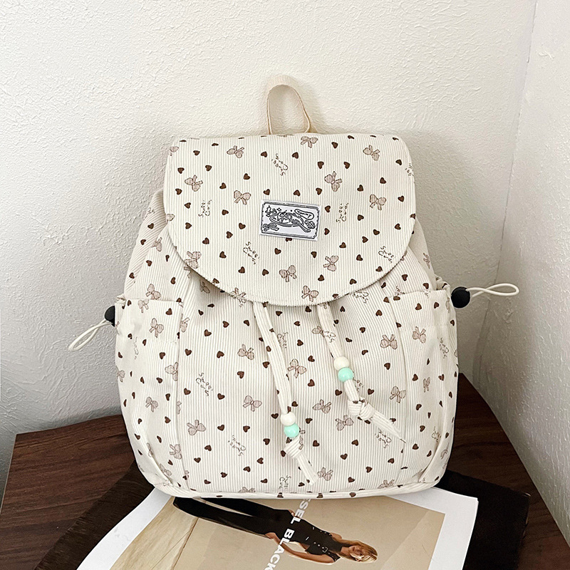 2026 mochila de viajes escolares de gran capacidad para mujeres coreanas frescas pequeñas ondas de diseño de moda mochila de moda mochila de moda