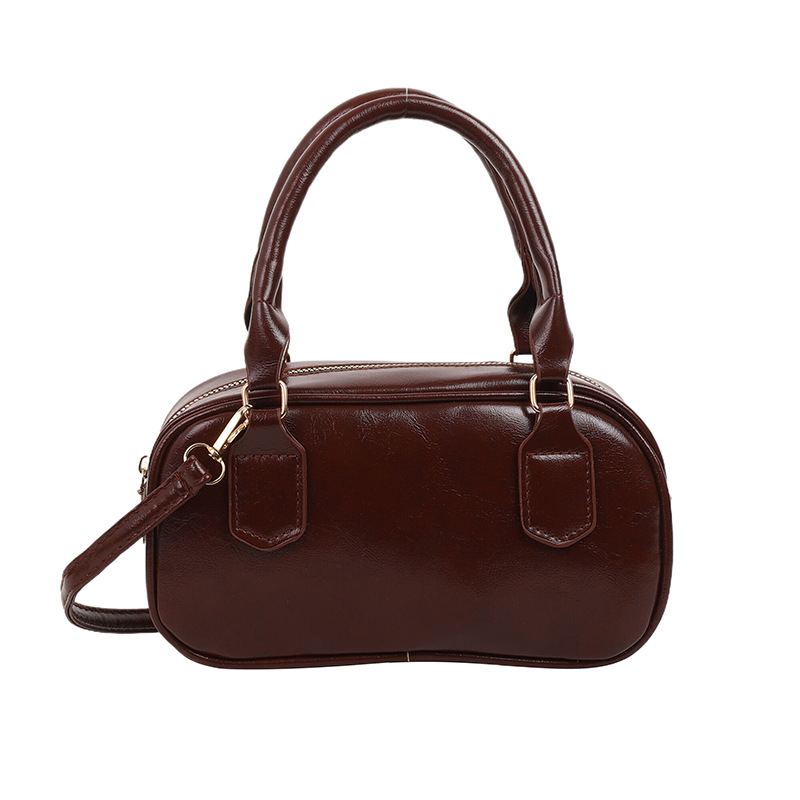 Versión coreana del bolso pequeño de Boston otoño e invierno nuevo bolso portátil para las axilas bolso de bolos literario de moda bolso diagonal de un solo hombro