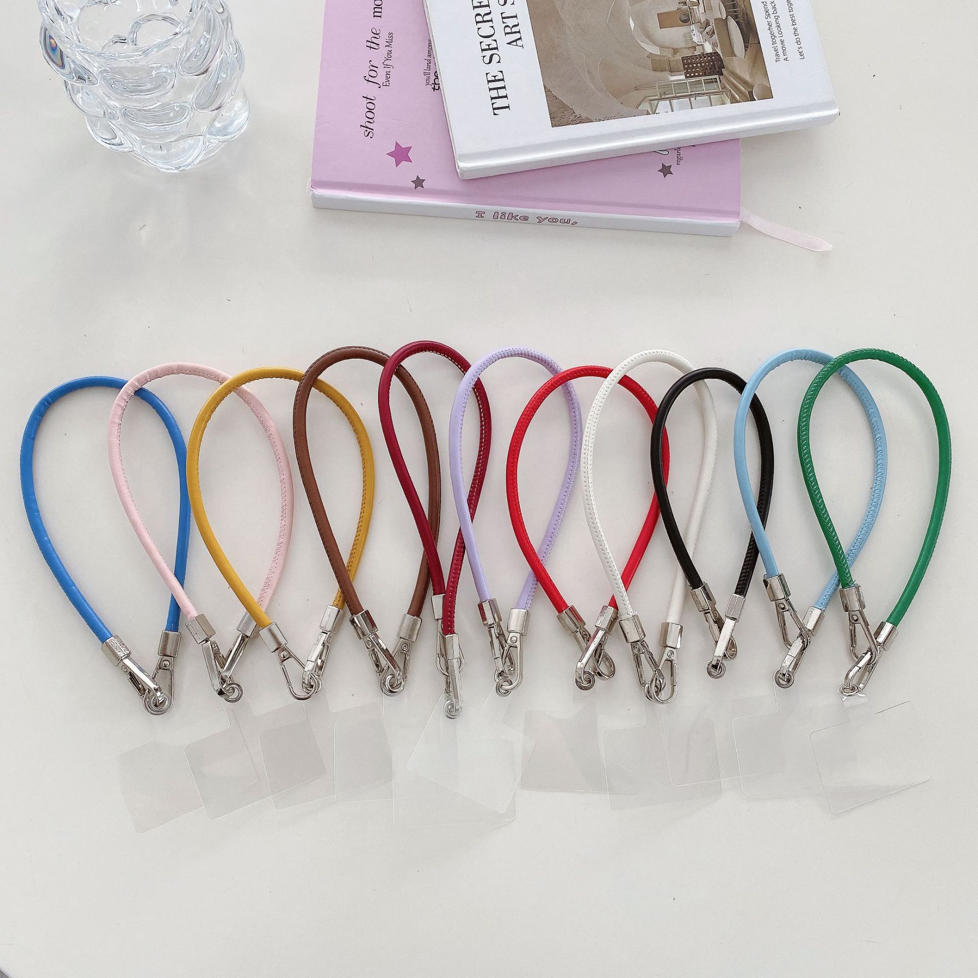 Nueva muñeca corta color cuero cuerda de mano funda para teléfono móvil colgante universal hombres y mujeres doble hebilla cadena colgante multicolor