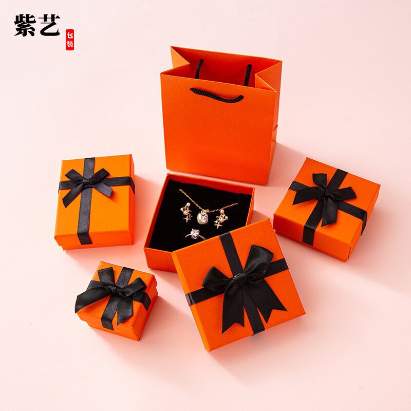 Más que en stock estilo cinta arco caja de embalaje caja de anillo pendientes joyas caja de regalo pendientes