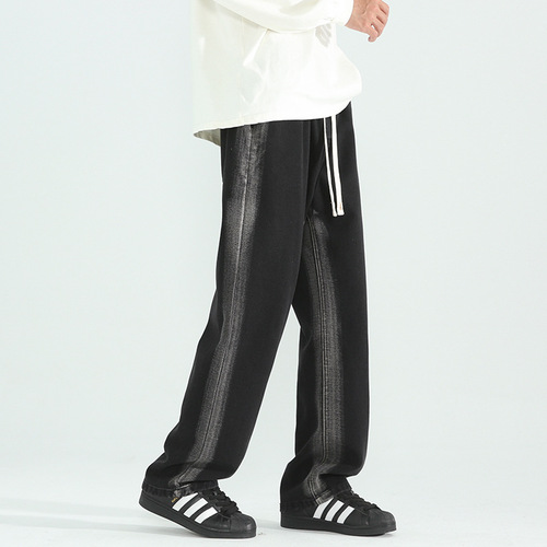 Vintage-style distressed washed denim jeans for men—trendy, loose-fit, straight-leg casual trousers for spring and autumn