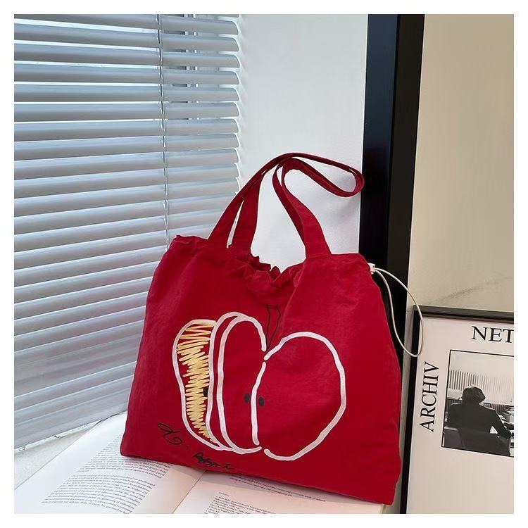 Autumn New Korean Style Drawstring Nylon Shoulder Bag, Fashionable and Stylish, Red and White Color-Blocking, Apple-Patterned Commuter Handbag for Women Autumn New Korean Style Drawstring Nylon Shoulder Bag, Fashionable and Stylish, Red and White Color-Blocking, Apple-Patterned Commuter Handbag for Women