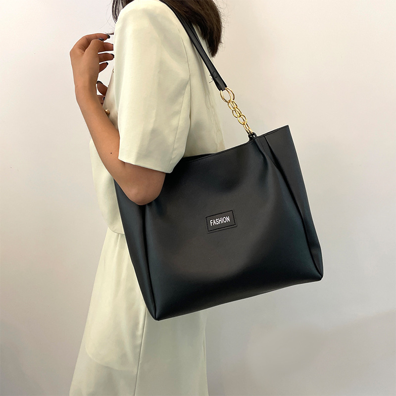 Este año, la textura Popular de gran capacidad tote paquete para mujeres 2024 nuevo paquete de clases para estudiantes de ocio de moda de moda paquete de cercanías