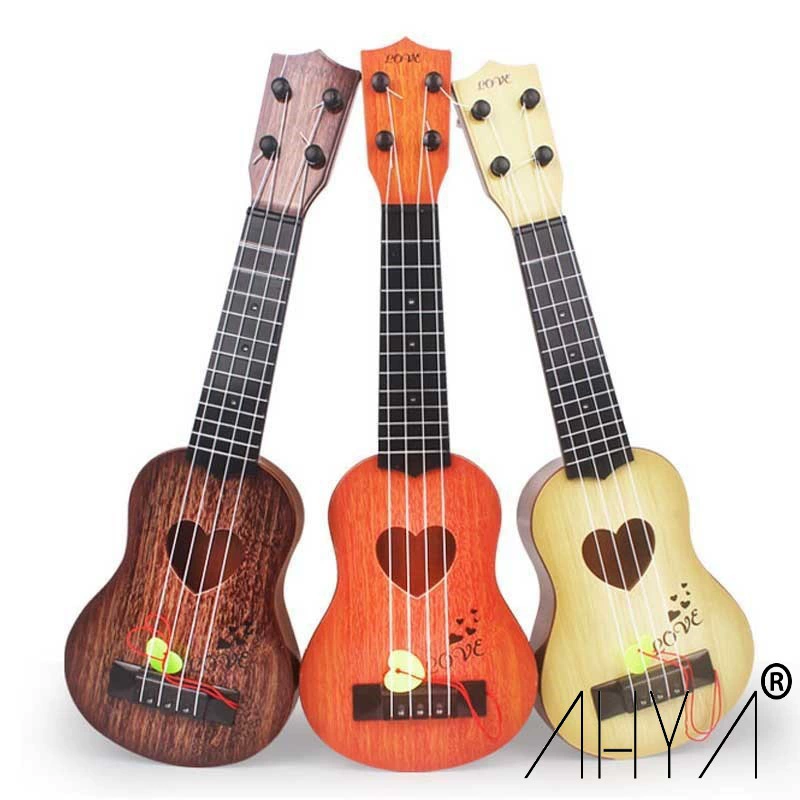 Ukulele with a score, guitar for beginners