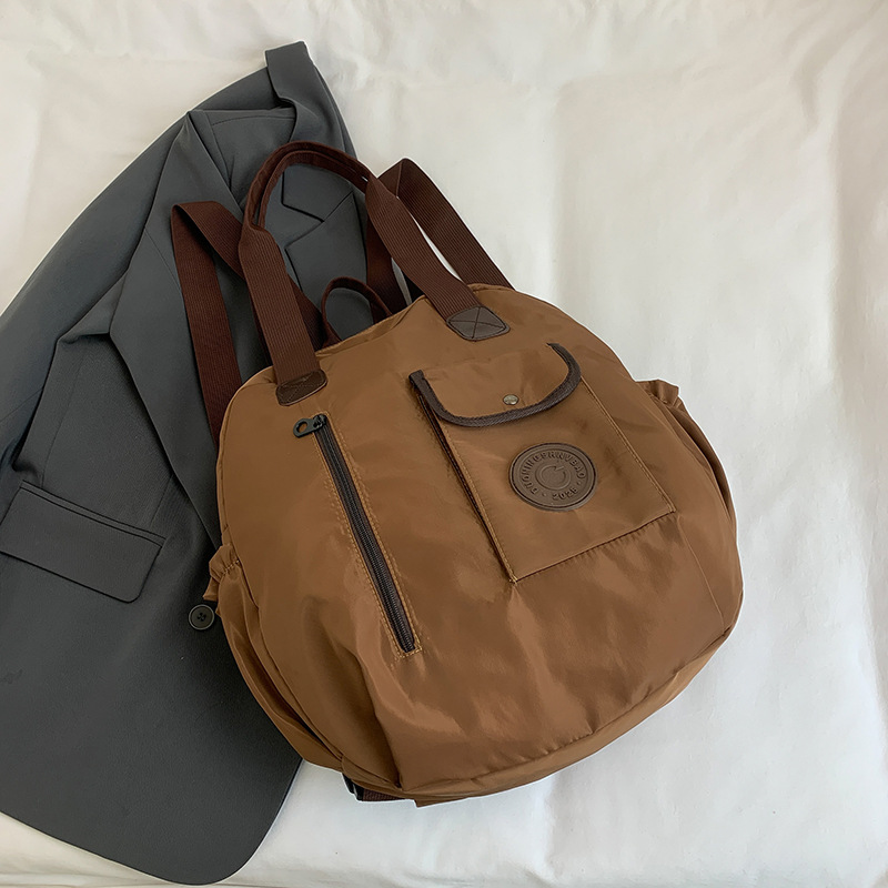 Otoño nuevo estilo de alta sensación compacto simple versátil gran capacidad viaje mochila de hombro bolsa multipropósito hombro