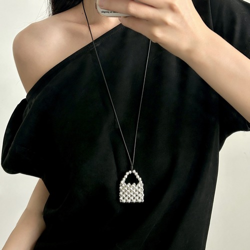 A handmade copper bead necklace with a vintage and unique design, featuring a long pendant shape inspired by Korean blogger accessories.