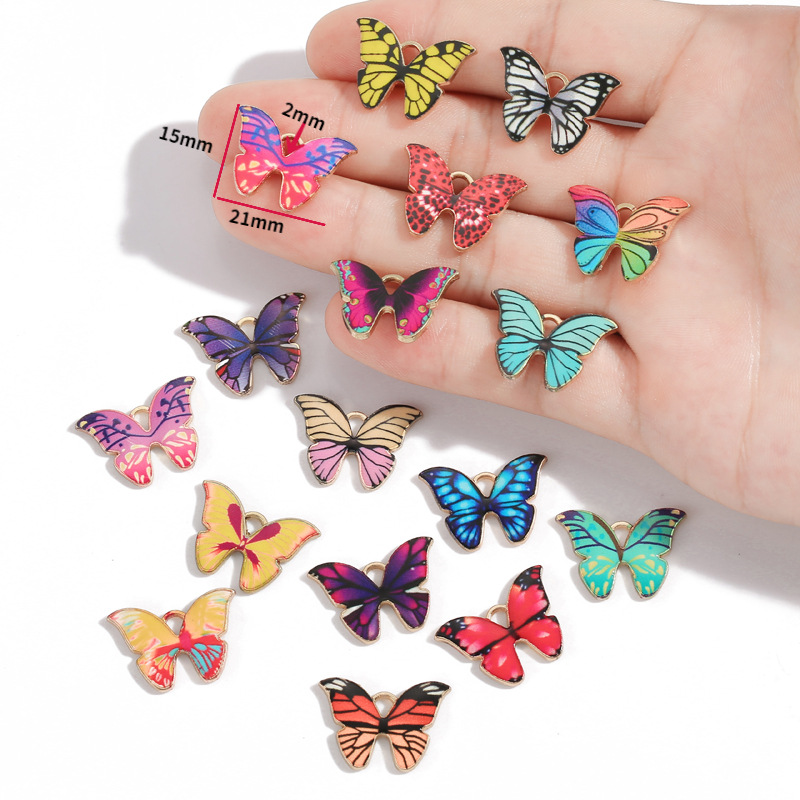 Venta caliente transfronteriza accesorios de joyería de moda europea y americana accesorios de mariposa de color accesorios de joyería de aceite de goteo de aleación 21*15mm