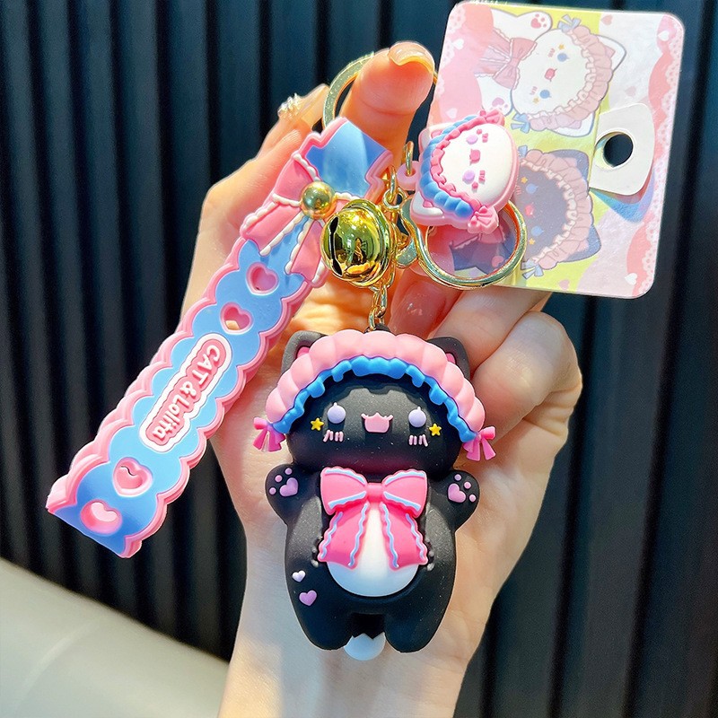 Keychain dinosaurio auténtico lindo bolso colgante de goma blanda llavero de automóvil muñeca pequeña máquina de regalos al por mayor image 16