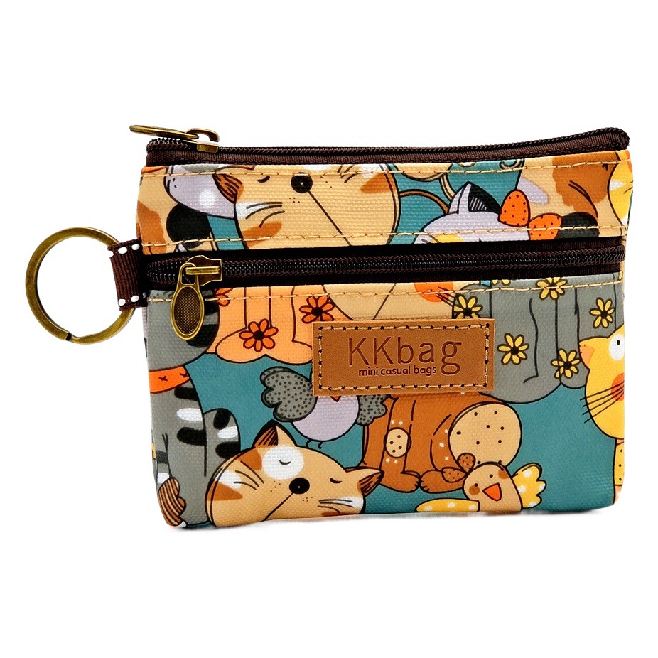 2023 nueva película impresa de dibujos animados monedero anti-incrustante lápiz labial impermeable bolsa de almacenamiento de monedas bolsa de medio bolso de las mujeres