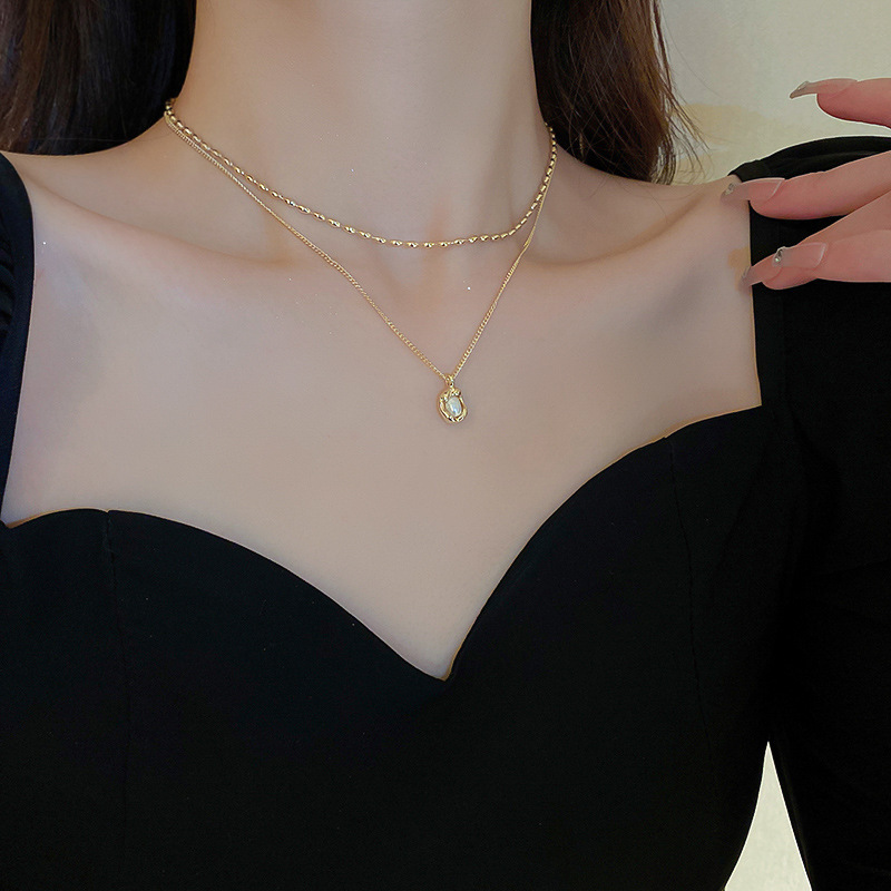 Collar de perlas con lazo de súper hada, cadena de clavícula de moda de lujo ligero francés, sentido de alta gama, joyería de nicho de arte, mujer al por mayor