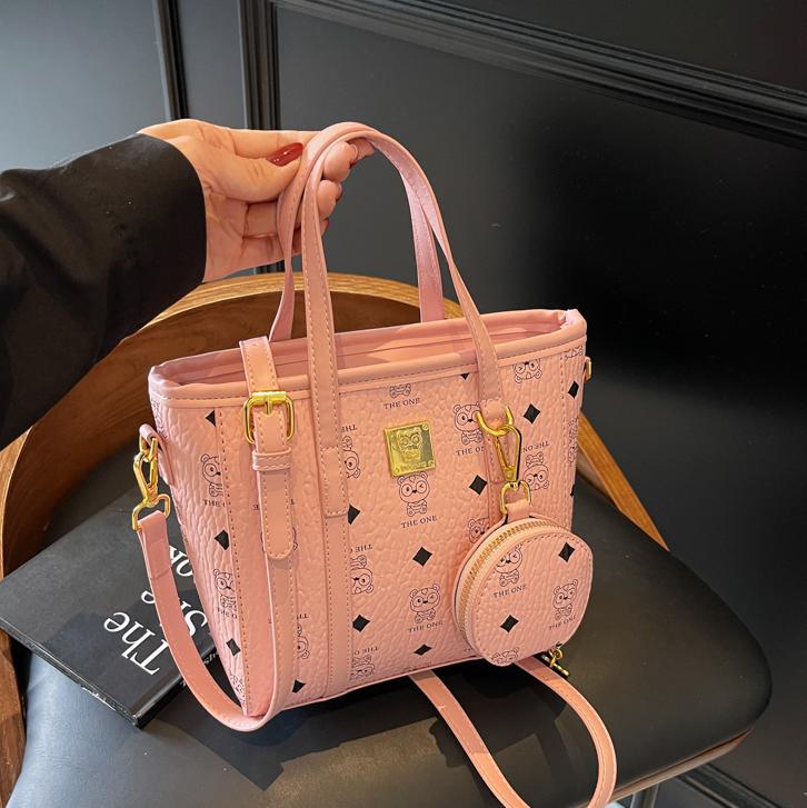 Bolsa de cubo portátil de impresión de moda super caliente para mujeres 2025, nuevo bolso de hombro de nicho universal, bolso de cinturón en línea.