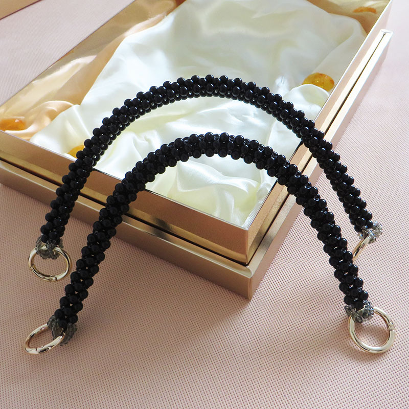 Black pearl-embellished handbag with short chain handle, beaded woven strap, shoulder bag chain.