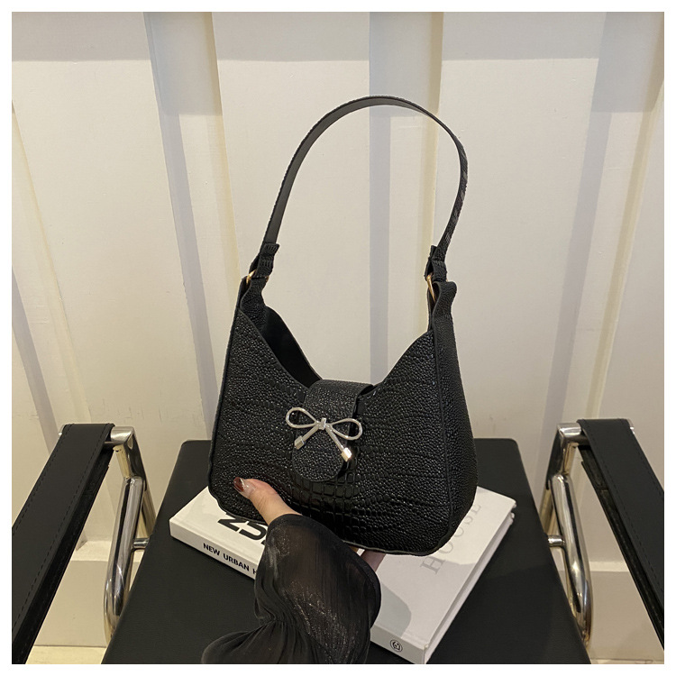 Bolso de mano con lazo de sentido de alta gama para mujer 2024 nuevo bolso de mensajero de cadena de primavera mini bolso de axila de un solo hombro