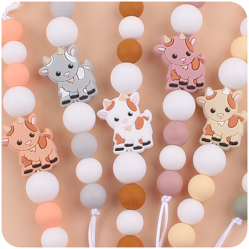 Nuevo bebé suministros chupete cadena creativa de dibujos animados Cordero silicona bebé mordedura cadena anti-gota molar