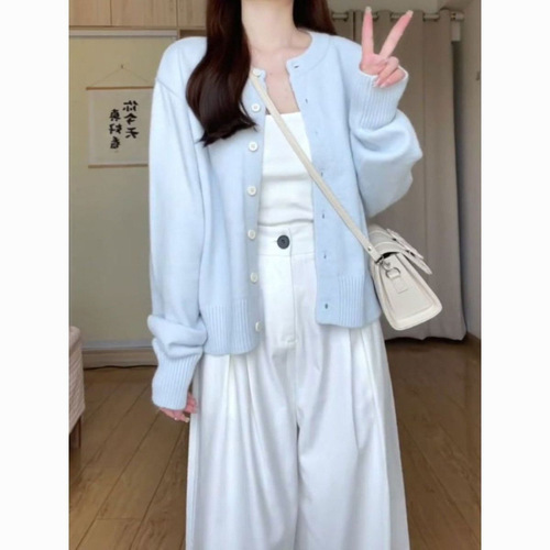 Soft and chewy light-blue knitted sweater for women's outerwear—simple, short cardigan-style jacket perfect for spring, autumn, and winter.