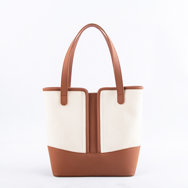 2026 Export Korean Designer Tote Bag Ins Blogger Niche Commuter Bag Canvas with Leather Handbag 2026 Export Korean Designer Tote Bag Ins Blogger Niche Commuter Bag Canvas with Leather Handbag