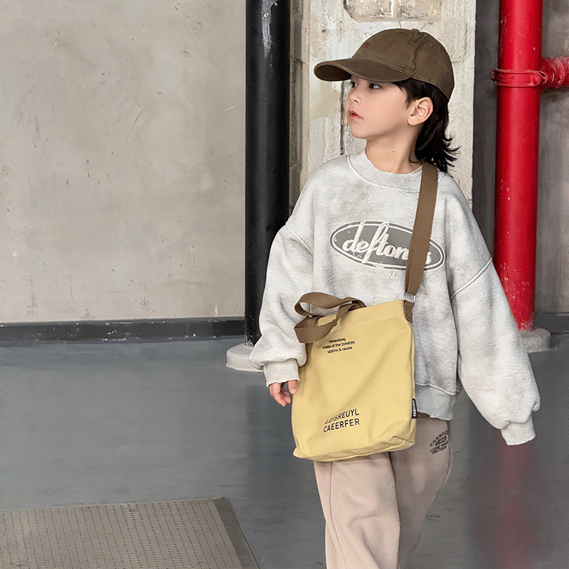 Bolso para niños con letras de estilo occidental Bolso de clase simple y ligero para estudiantes 2025 nuevo bolso de lona para niños y niñas