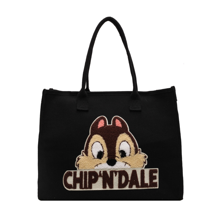 Bolsa de lona de gran capacidad para mujeres 2025 nuevo estilo urbano minimalista de moda de dibujos animados portátil de hombro para viajar bolsa