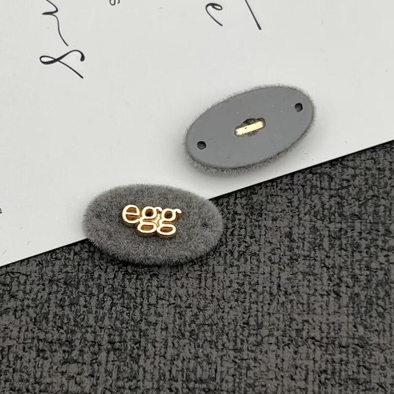 灰色系树脂组合纽扣标牌字母蝴蝶结小狗安心商标植绒针织衣标辅料|undefined