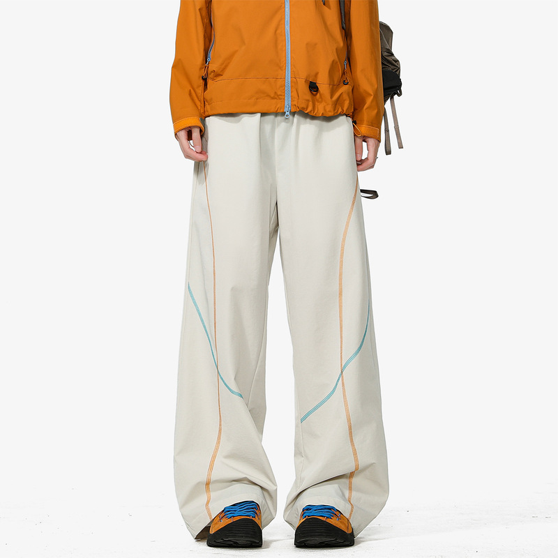 Off-white contrast orange and blue curved seam outdoor pants, loose and drapey wide-leg quick-dry hiking casual long pants for women