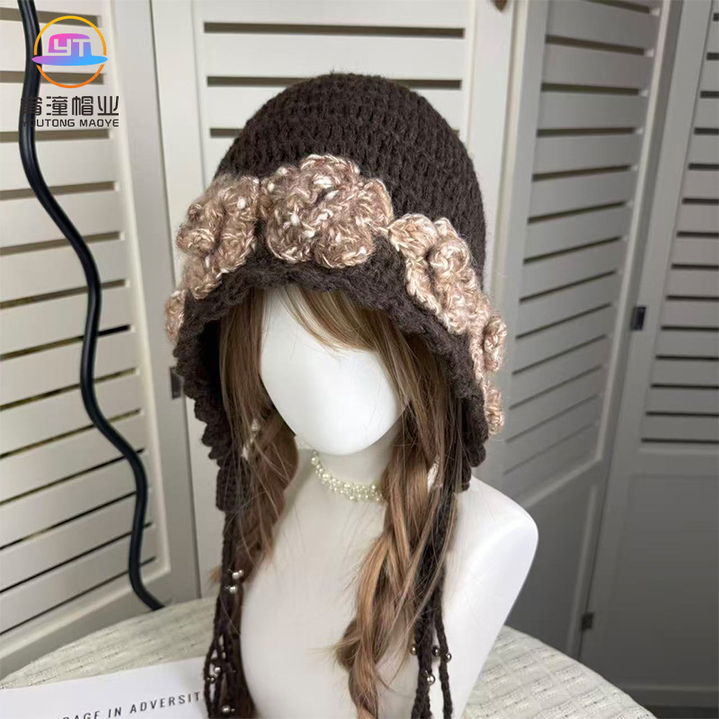 Autumn and winter handmade crocheted 3D flower hat, knitted beanie with tassels, warm and ear-protecting wool hat for women Autumn and winter handmade crocheted 3D flower hat, knitted beanie with tassels, warm and ear-protecting wool hat for women