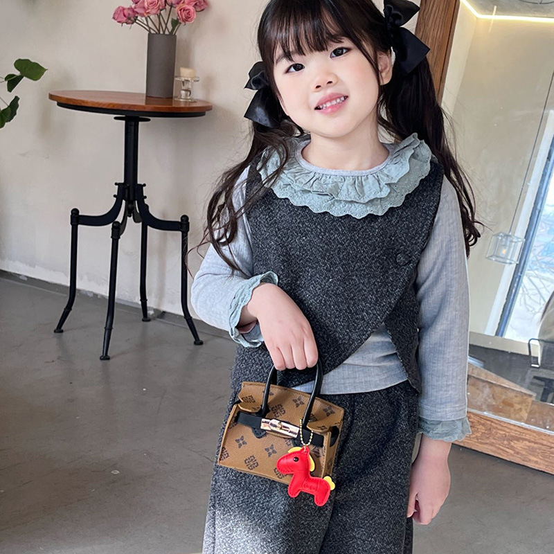 Impresión de moda coreana bolsos de chicas lindos colgantes de pony bolsos de hombro de aire extranjero mini bolsos de niños