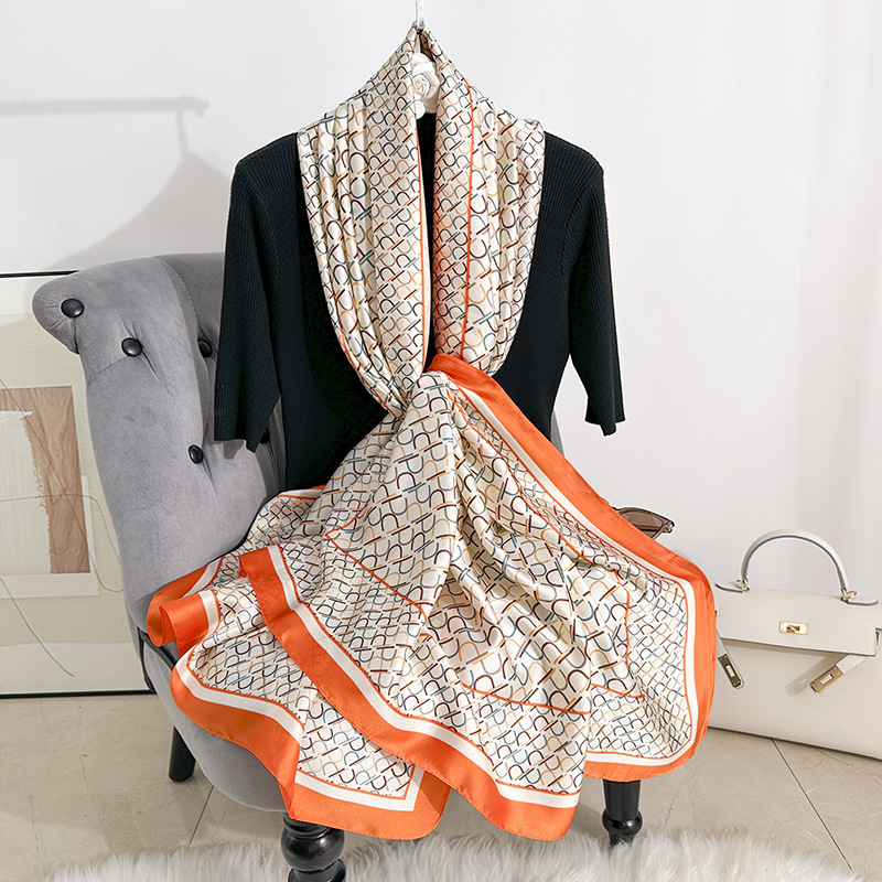 Pañuelo de seda estampado de temperamento elegante para mujer, protector solar de playa de alta gama, nueva bufanda de satén de seda, chal de habitación con aire acondicionado fino de verano