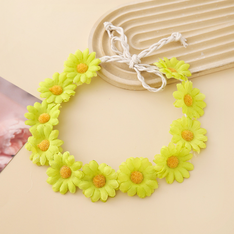 女性の女の子のヘアバンドは11輪の花の頭を編んで小さい太陽の花を持って旅行します。|undefined