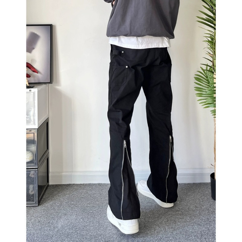 Pure black workwear pants with back pocket flap and buckle, full-length metal zippers on both sides, slightly flared, loose-fitting casual denim pants Pure black workwear pants with back pocket flap and buckle, full-length metal zippers on both sides, slightly flared, loose-fitting casual denim pants