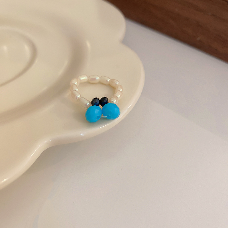 レトロな円形の緑松石の開口指輪の宮廷風の大衆の設計のファッション的な指輪の軽い贅沢な高級感の食指の指輪